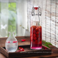 Wholesale Clear Round Glass Beer Bottles Beverage bottles with swing top